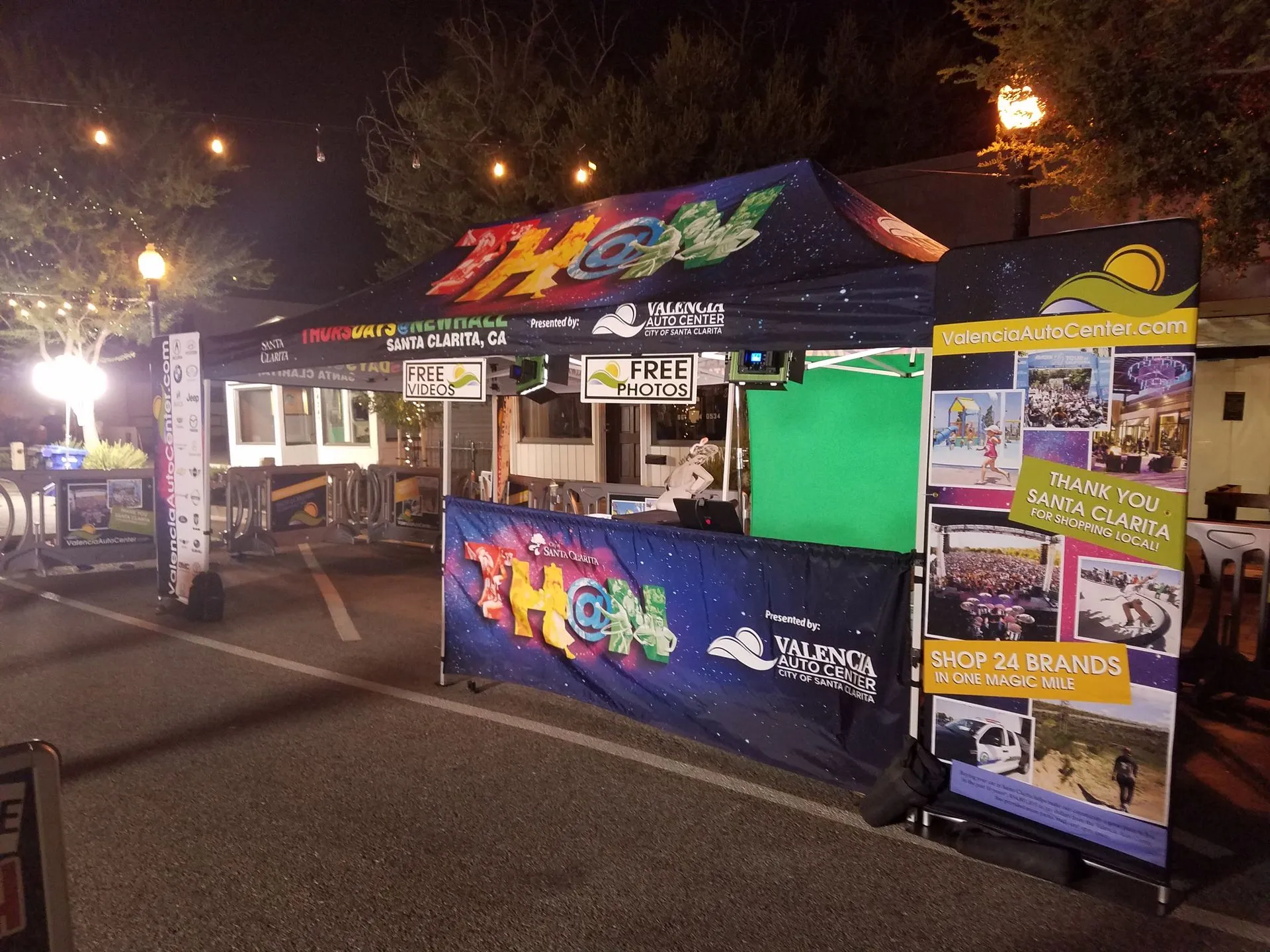 Branded sponsor activation tent set up at an outdoor community event