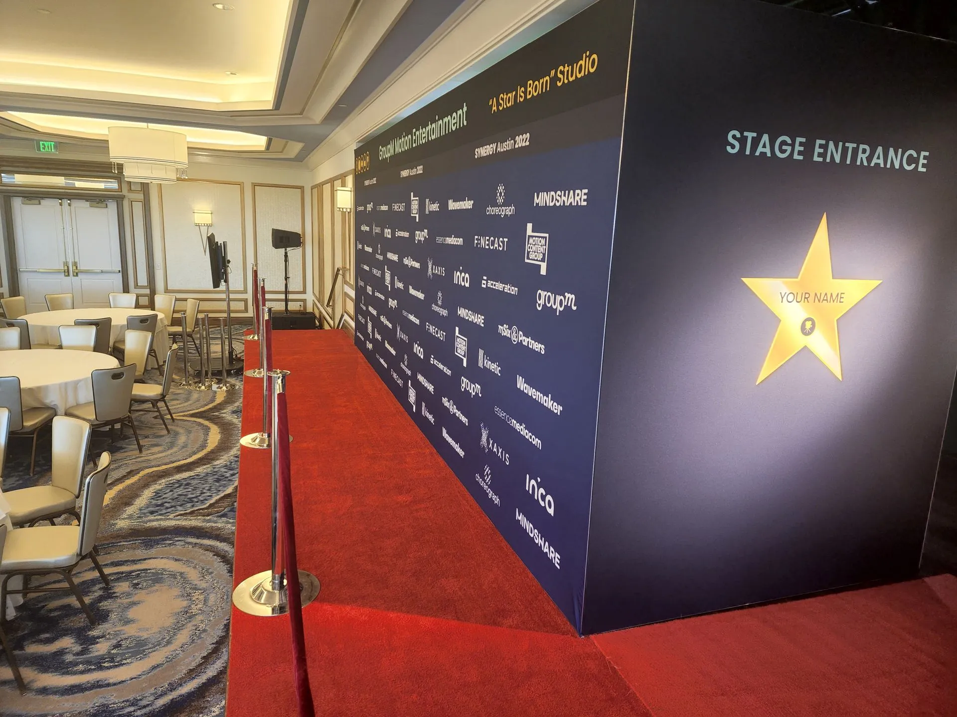 Red carpet and branded step-and-repeat built for a premiere-style activation